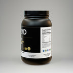 Black supplement container with visible branding on a gray background