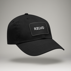 Black cap with 'RZLVD' logo on a gray background