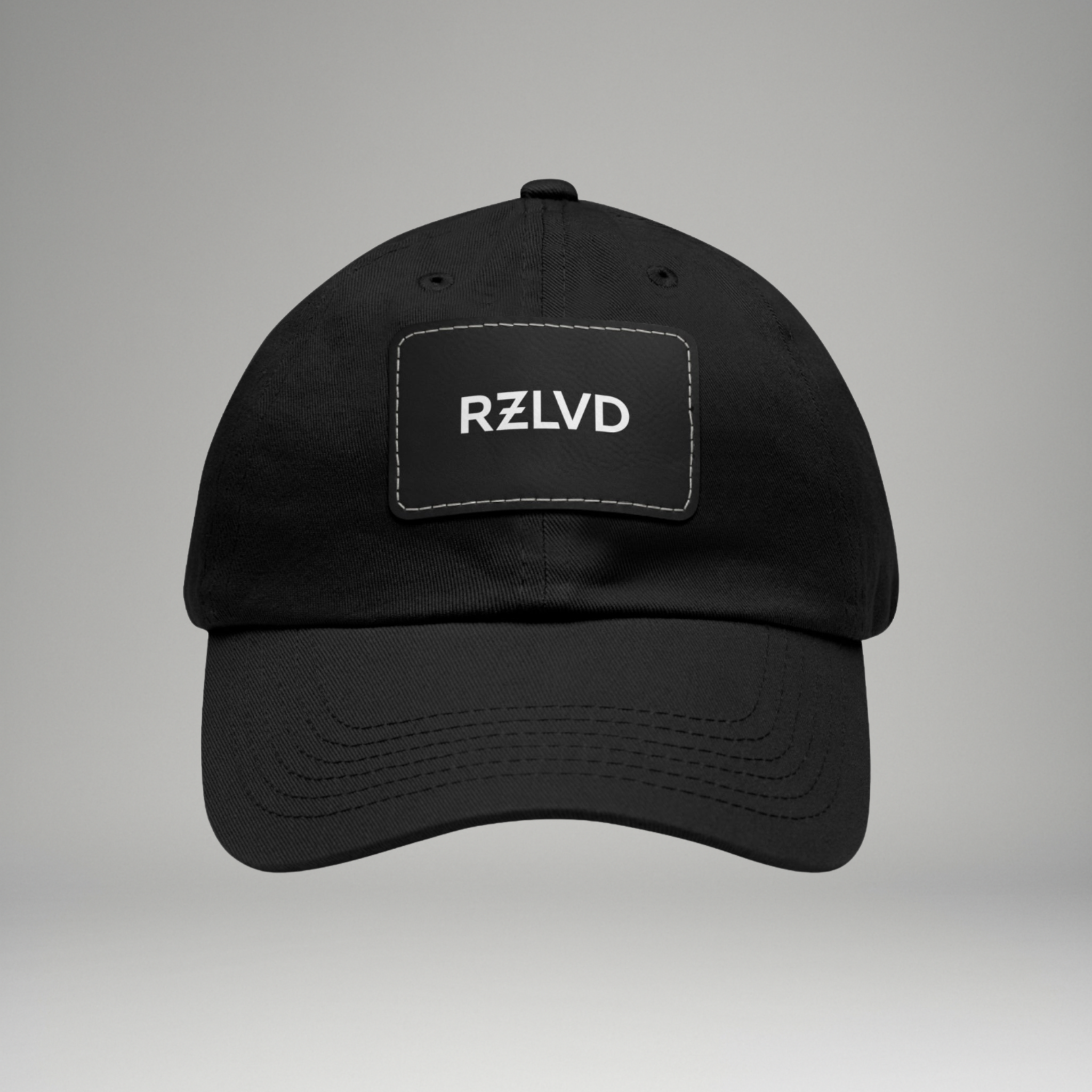 Black cap with 'RZLVD' logo on a gray background
