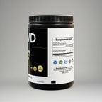Black supplement container with white label on a gray background