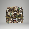 Camouflage trucker hat with 'RZLVD' branding on a gray background