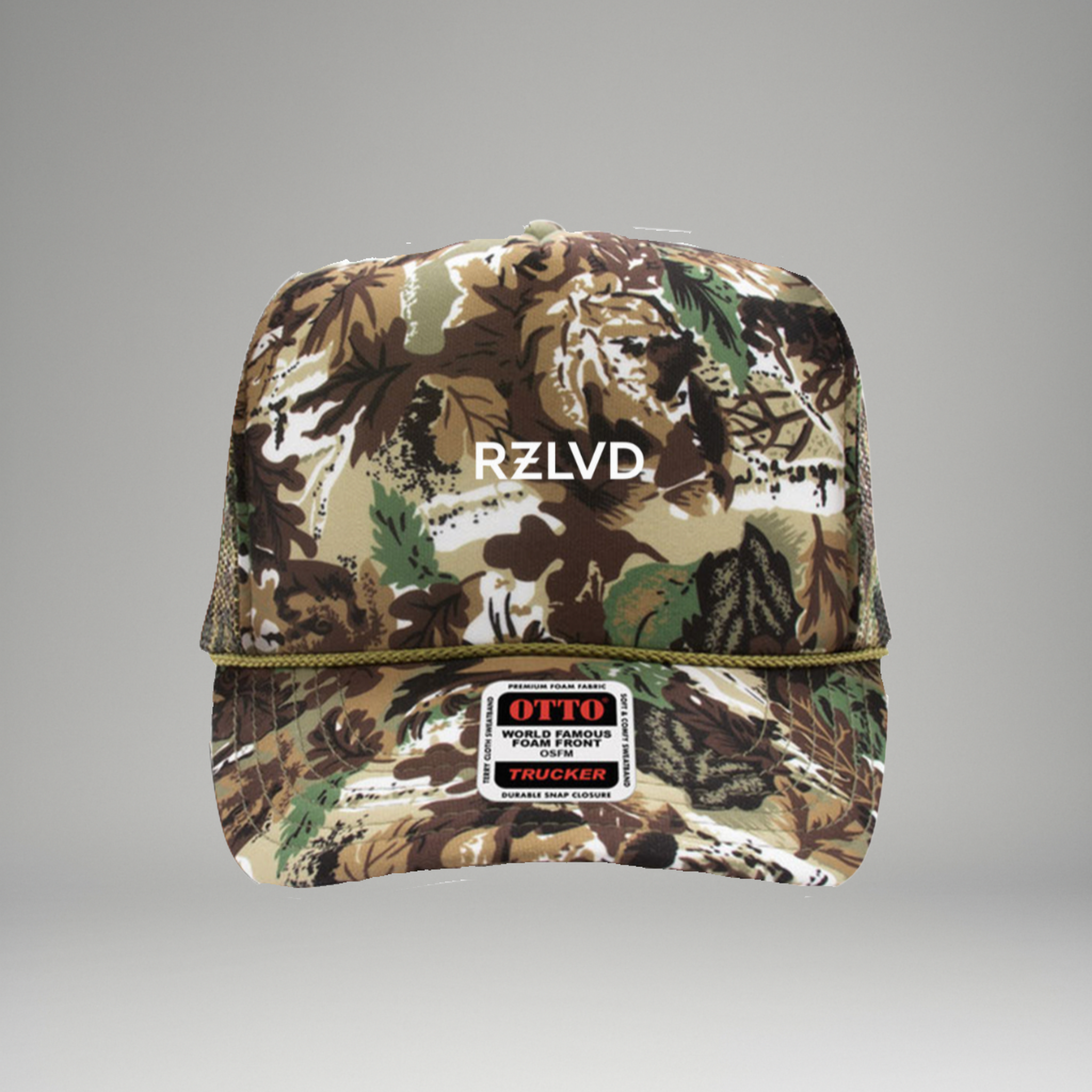 Camouflage trucker hat with 'RZLVD' branding on a gray background