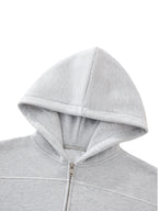 Gray hoodie with a zipper on a white background